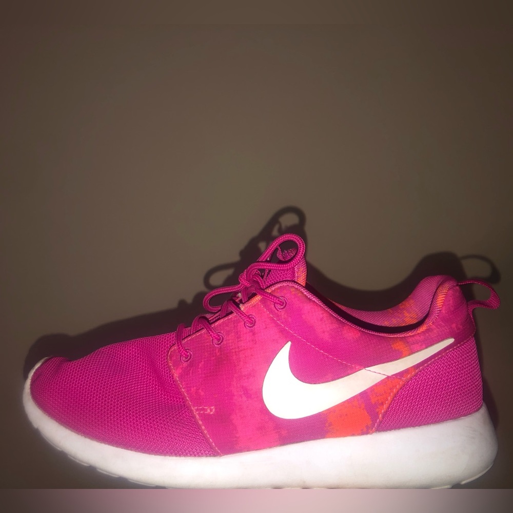 Pink with hints of orange NIKE running shoes